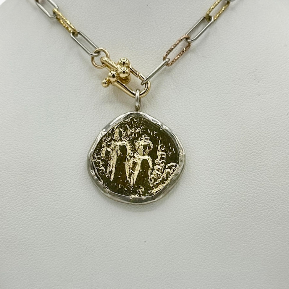 closeup-of-two-tone-gold-silver-coin-pendant-on-chain-belaorca-jewelry