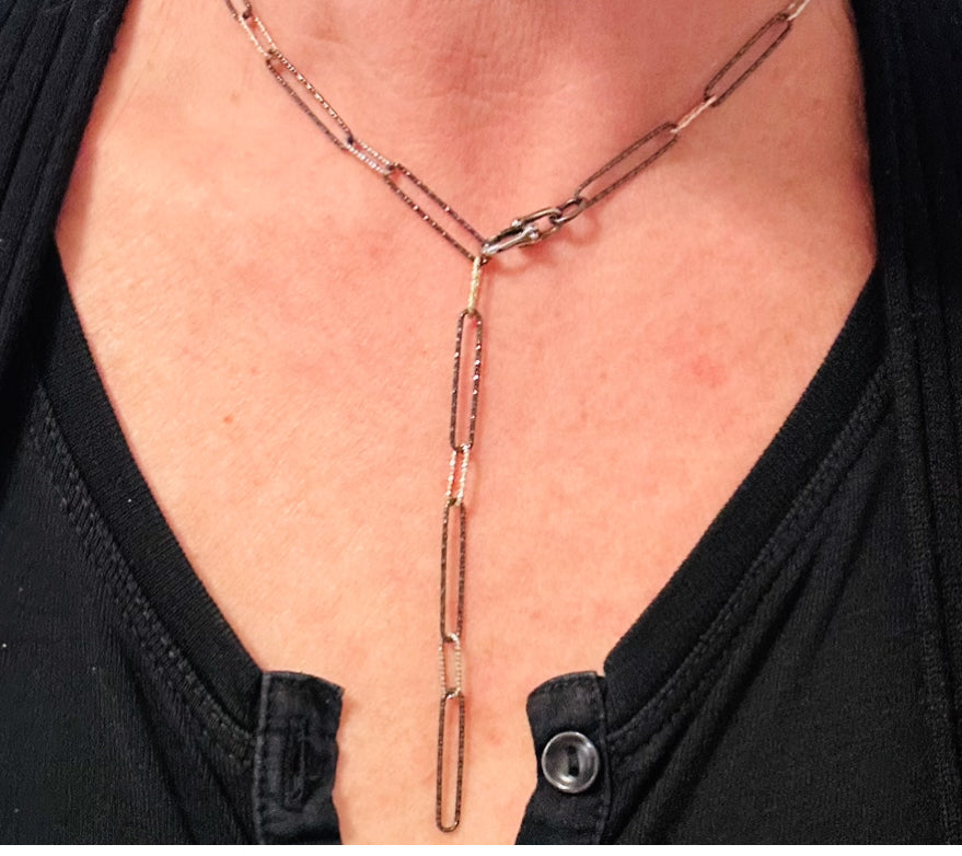 Paper-clip-necklace-on-model-neck-laid-as-lariat-belaroca-jewelry