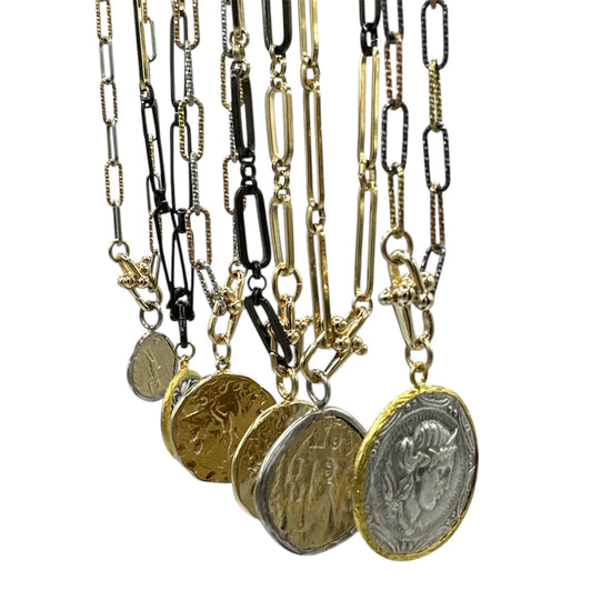 Picture- of -various- necklaces -with coin -pendants -hanging -off -of -them-belaroca-jewelry