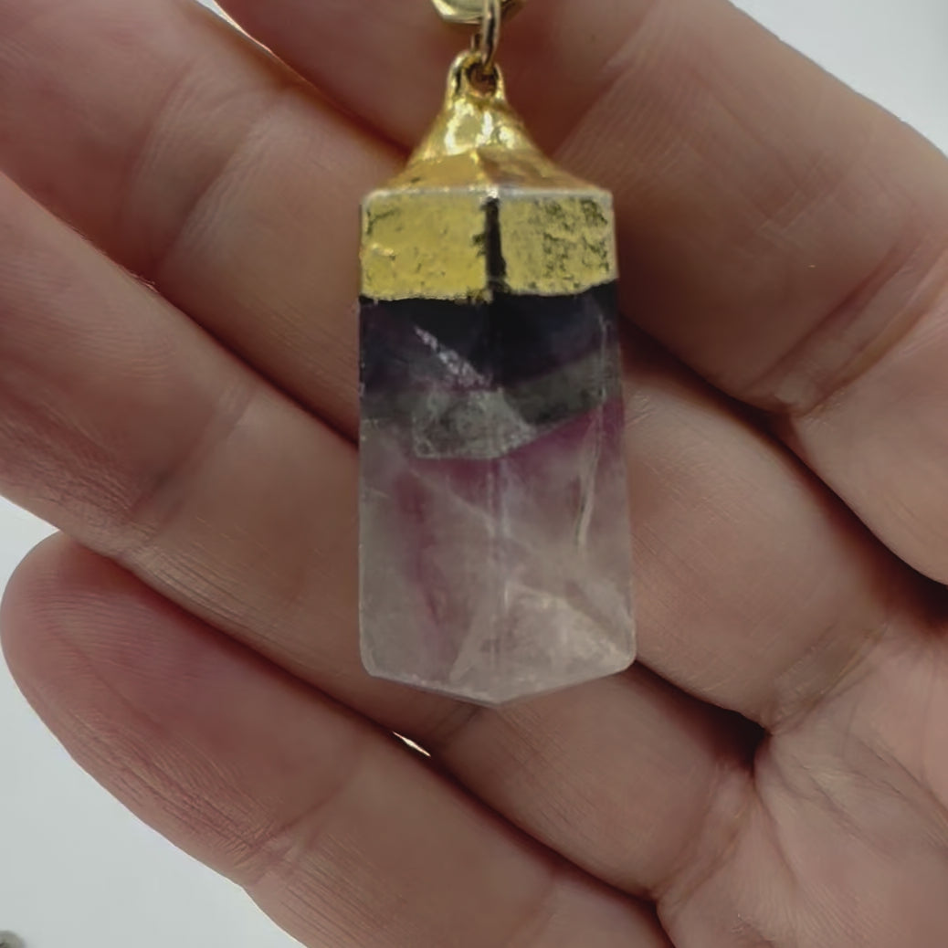 small-amtheyst-point-pendant-moving-on hanbd-of-model-belaroca-jewelry