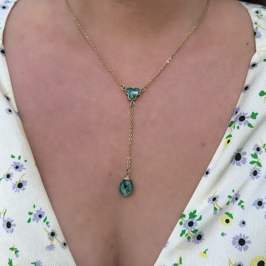 Gold-malachite-lariat-necklace-on-model-with flower-top