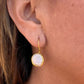 round-coin-gold-earrings-on-model-belaroca-jewelry