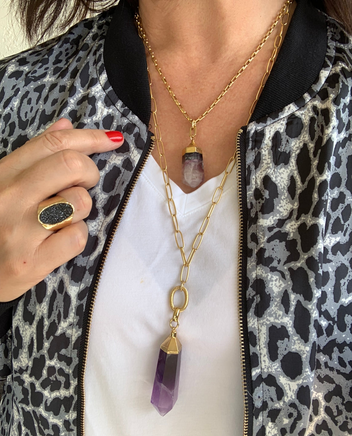 IMG_Model-Wearing-two-amethyst-gemstone-point-pendants-in-gold-chains-and-drusy-blacak-rin-belaroca-jewelry